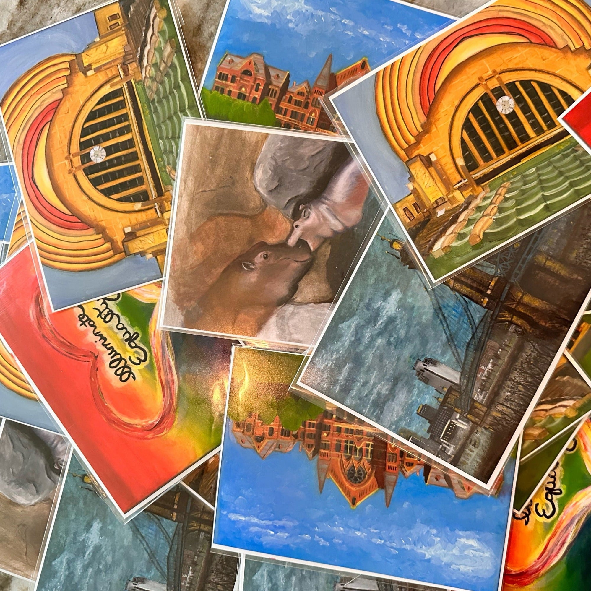 Scattered art prints on a table